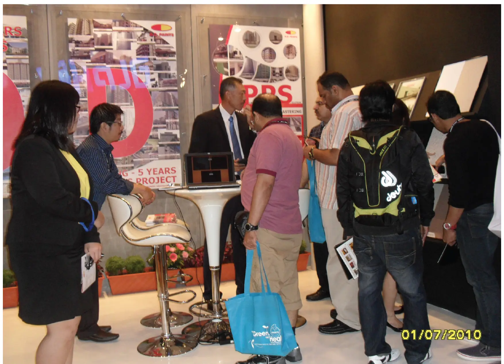 Visitors learning about O.D. Paints products at the company’s ARCHIDEX exhibition booth