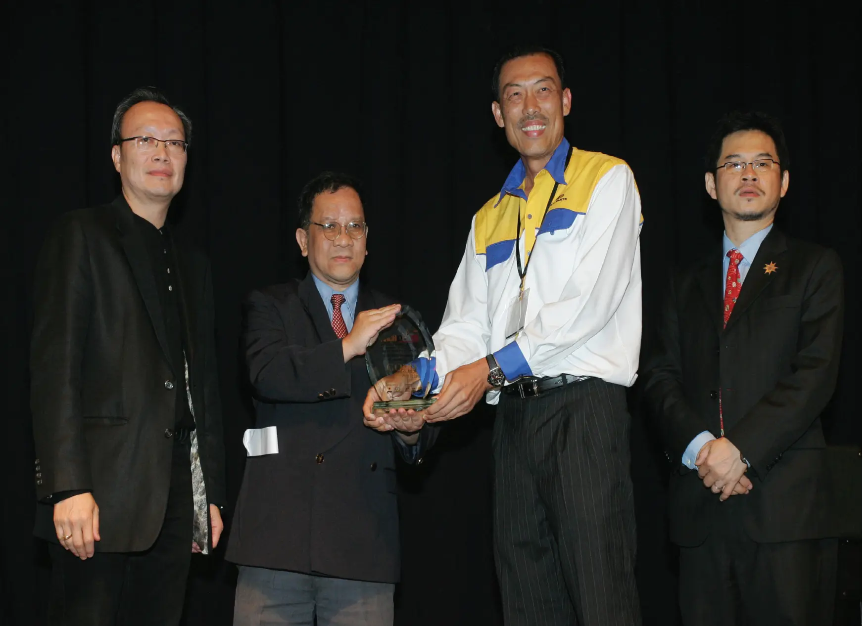 O.D. Paints representative receiving recognition during a Malaysian industry event