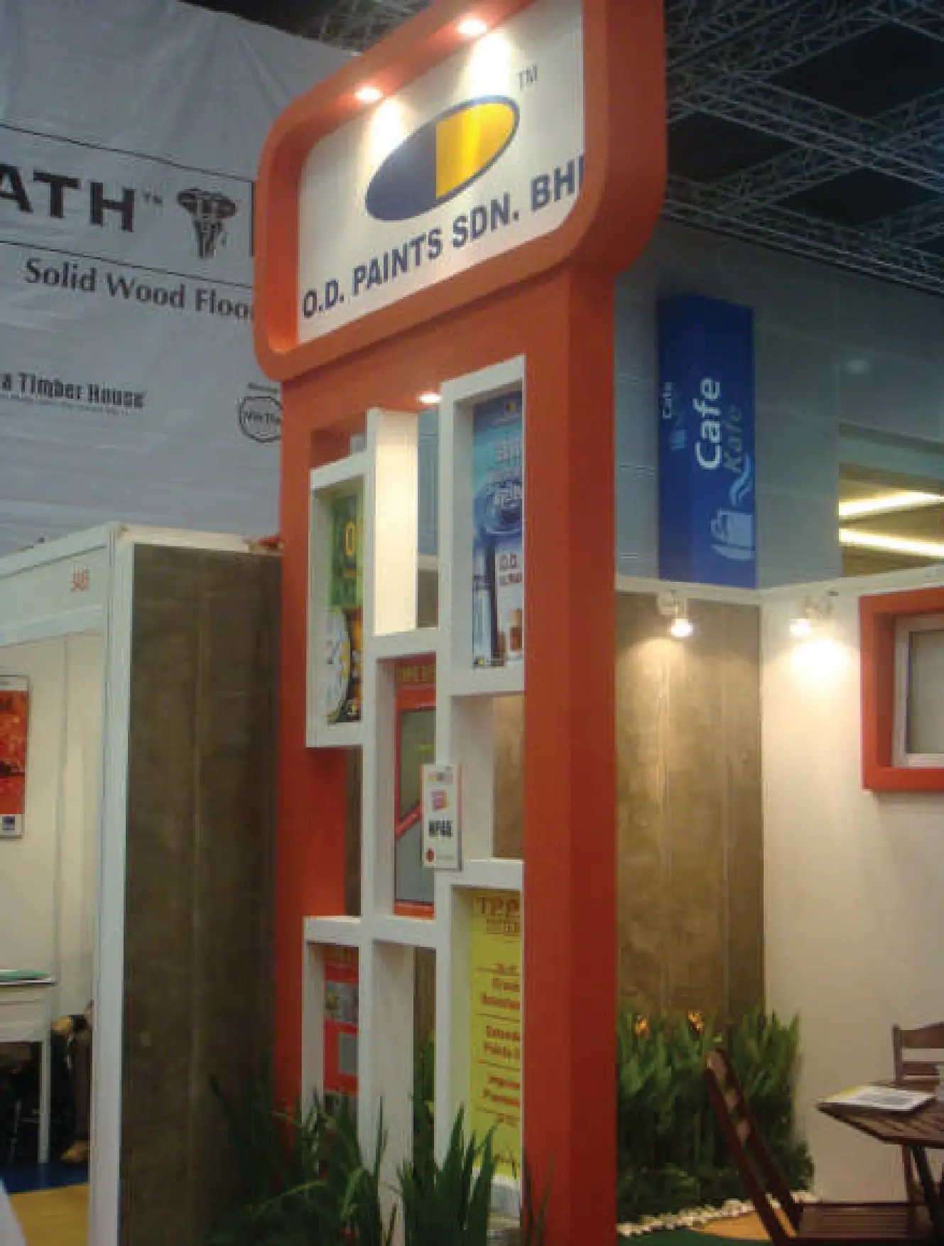 Portrait view of the O.D. Paints booth displaying coating products at ARCHIDEX